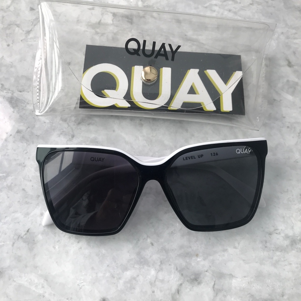 Quay Sunglasses, excellent condition. White with black frames.